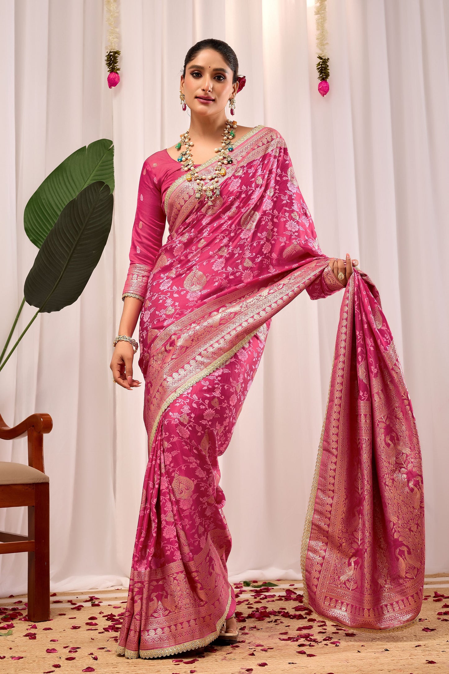 Elegant Rose Pink Floral Saree Featuring Traditional Motifs and Rich Zari Border for Festive Occasions